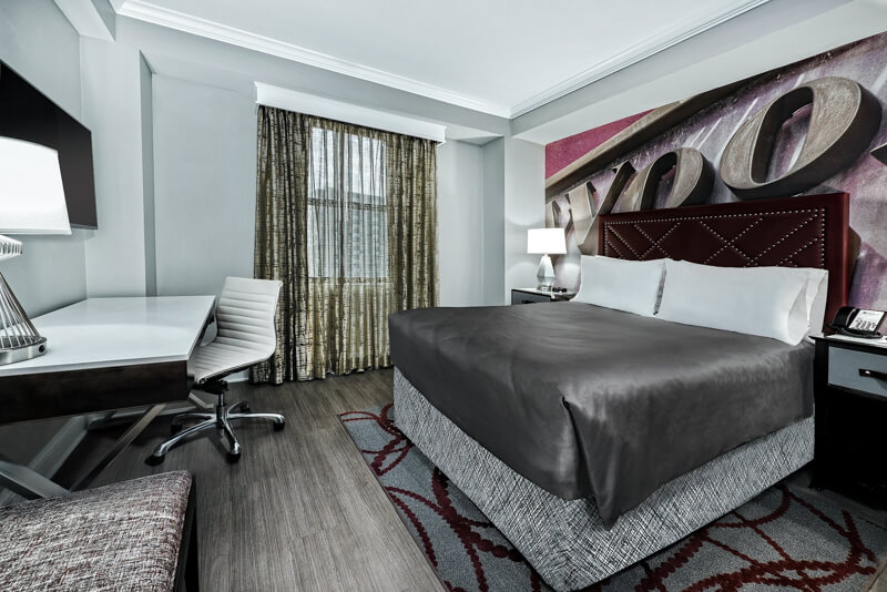 Hotel_Indigo_Dallas_Downtown-Room-Dr_Larry_Wolford-Hotel_Info